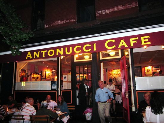 exterior photo of antonucci cafe with people eating outside and inside 