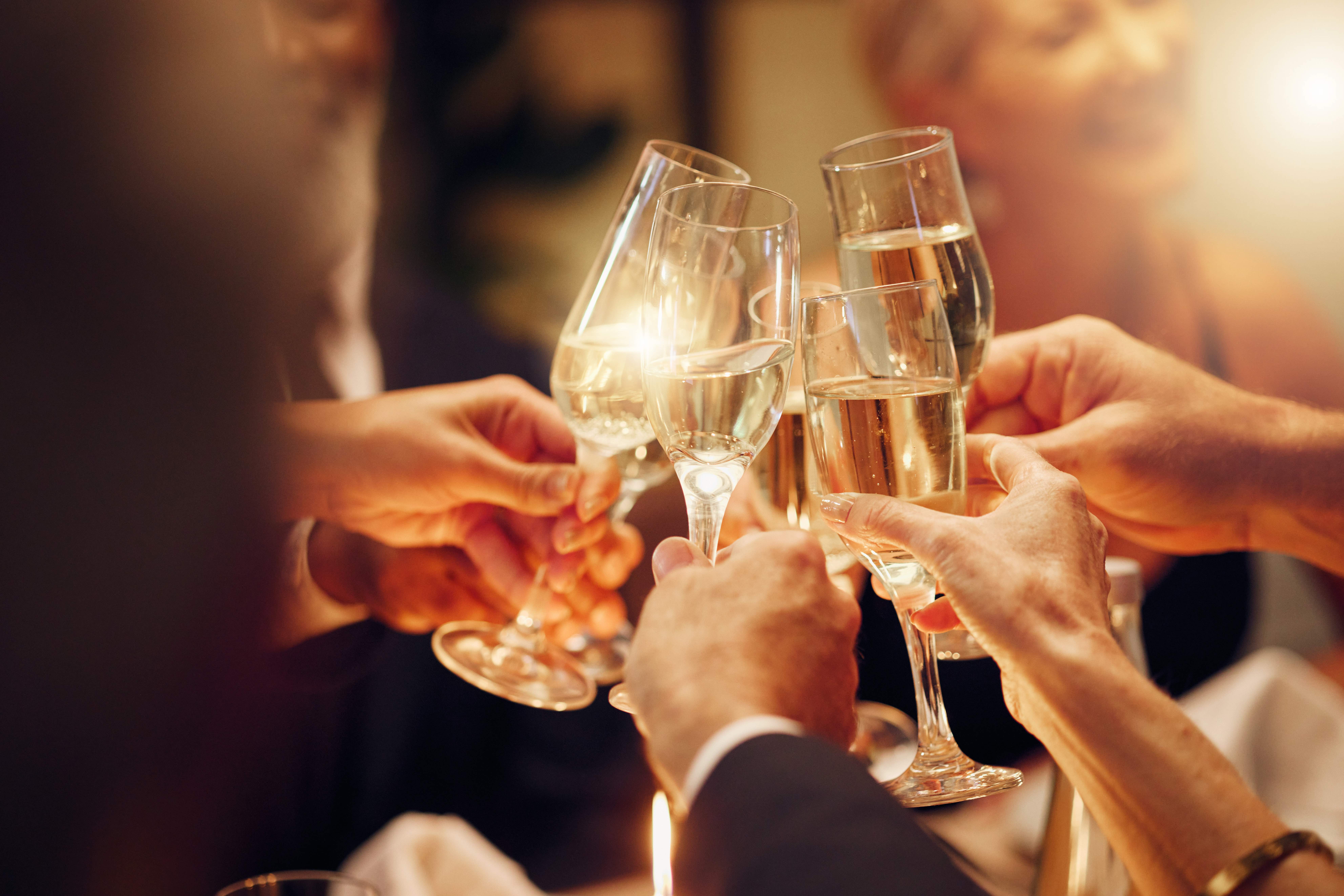 friends cheering champagne glasses