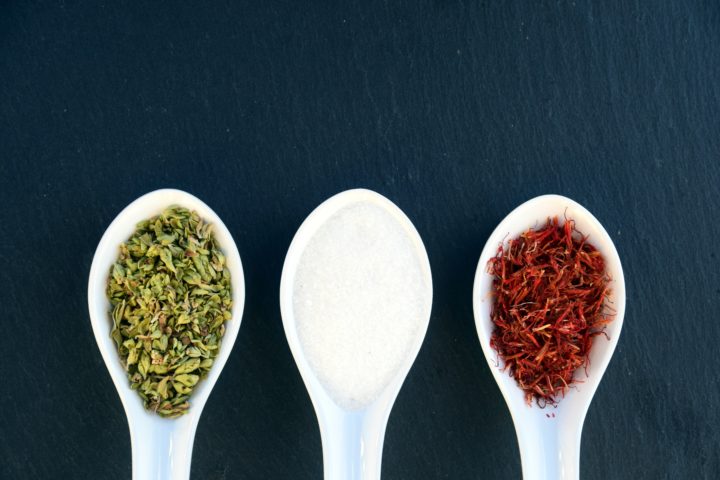 Three spoons with different spices in them
