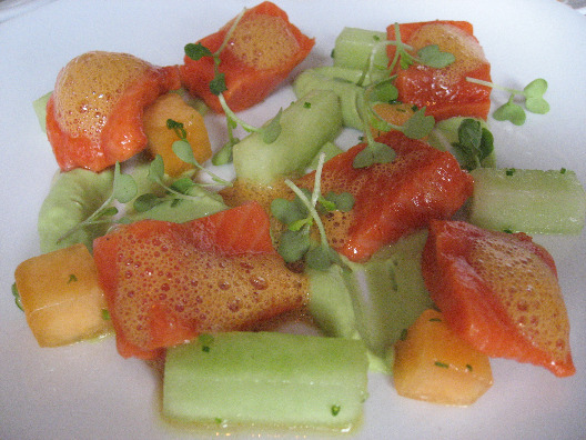 Chef Ryan Skeen sockeyed salmon entree with chilled melon, avocado puree and tomato ginger sauce
