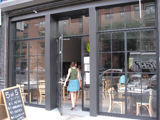 5 & Diamond Restaurant NYC exterior with open windows with dark grey trim