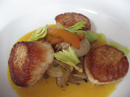 Chef Ryan Skeen seared scallops in sweet apricot gazpacho, grilled onions and celery