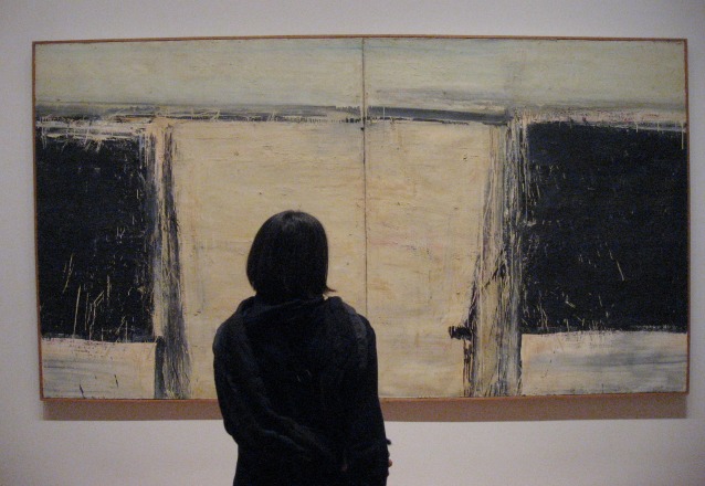 Abstract Expressionist at the Museum of Modern Art - Alfred Leslies two panel with black and white blocks of color - a female dress in black gazing at it.