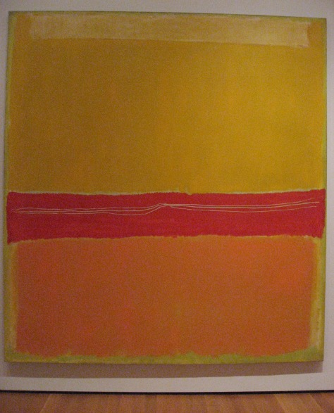 An abstract expressionist piece in yellow, red and orange, blocks of color in this Mark Rothko piece