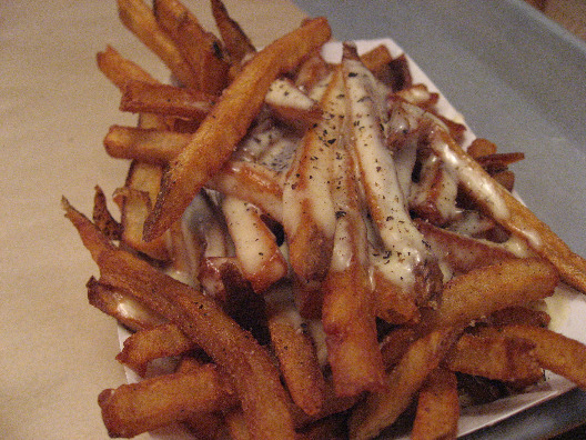 Bark Hot Dogs NYC serves up french fries with a creamy aoili sauce.