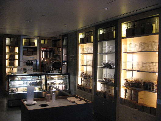 Momofuku NYC restaurant interior with glass cabinets full of baked goods