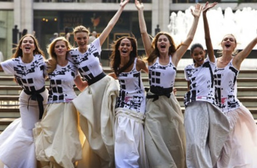 Fahion Night Out models in NYC in geometric patterns tanks and long varying shades of white shirts