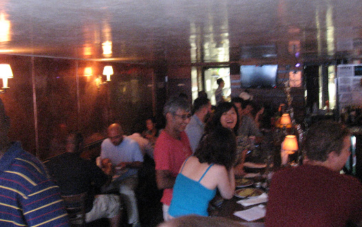 Interior of Fatty Cue low lights, big mirrors and a hip crowd
