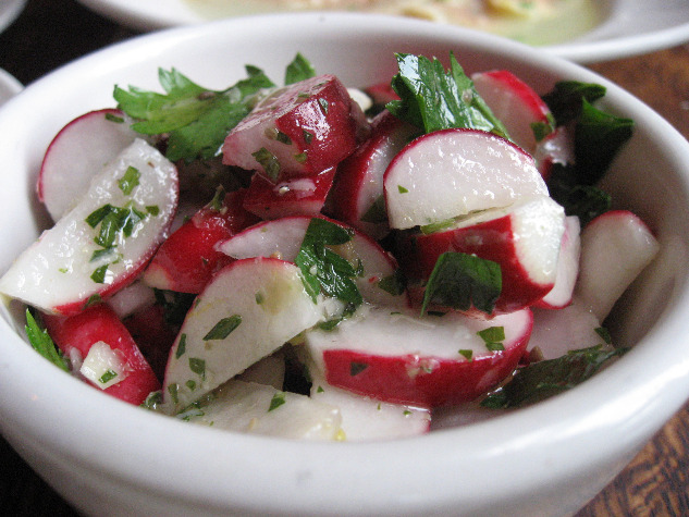 Frankies Spuntino restaurant radish and beet salad with parsey in a white bowl