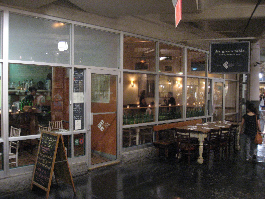 The Green Table NYC exterior from inside Chelsea Market open window design and country style tables and seating