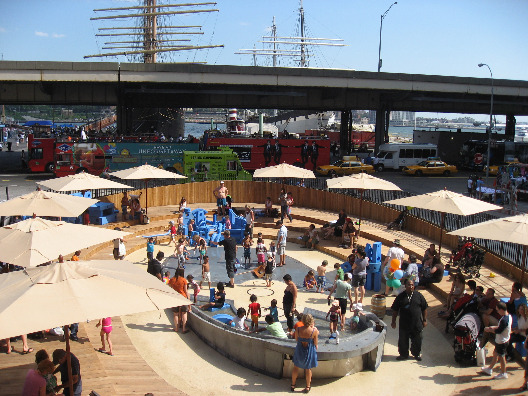 The Imagination Playground resembles a ship from afar with umbrellas for visitors to get some shade