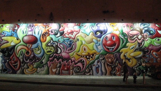 Silly smiley faces and facial expressions in cartoons on a mural on Houston Street painted by artist Kenny Scharf