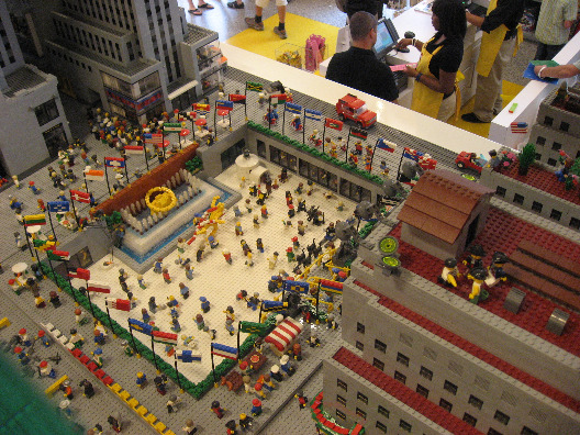 Legos Stores replica of Rockefeller Center with Lego skaters, tourists and gawkers surrounded by Lego buildings.