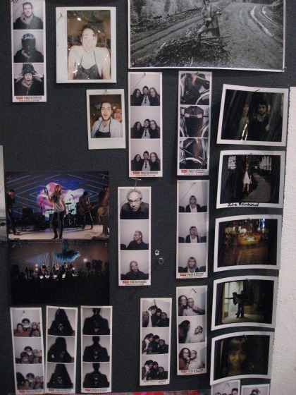 A wall full of various photographs including photo booth images at the Levi's Photo Workshop