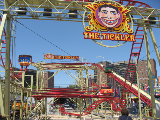 Luna Park in Brooklyn entrance to the Tickler with retro carnival mustached man 