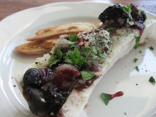 M. Wells in Queens plate of escargot and marrow topped with buttery herbs and a side of toasts.
