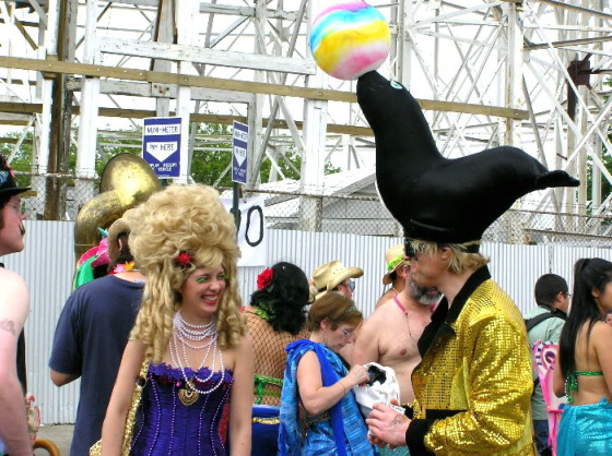 Mermaid Parade in Coney Island spectators wearing mermaid costumes with elaborate head pieces