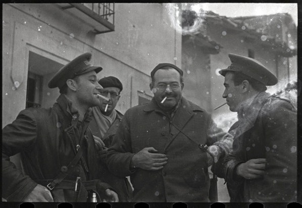 Four men smoking cigarettes in the Spanish Civil War at the International Museum of Photography in New York