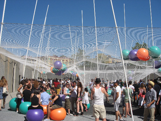 A big crowd gathers at the PS1 Solid Objective Pole Dance event