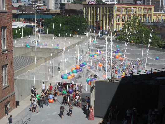 PS1 NYC young architects program pole dance with poles, netting and rubber balls