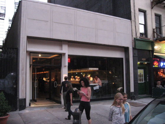 Momoyo Sushi NYC exterior with concrete walls and open window modern design
