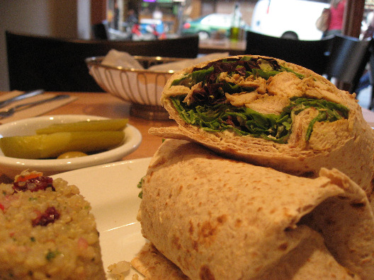 Nanoosh NYC chicken wrap with lettuce, sides of quinoa, pickles and olives