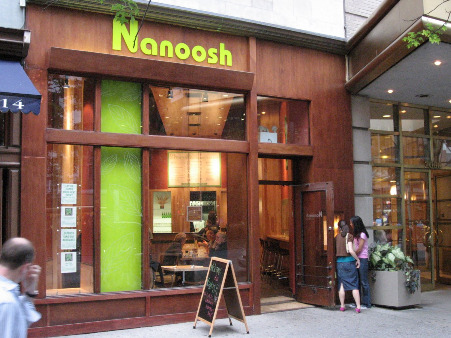 Nanoosh NYC exterior wood with green signage and accents and big open windows