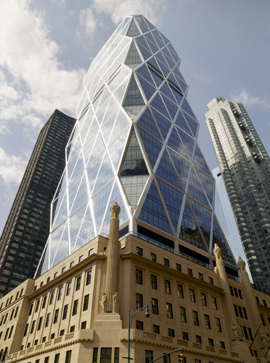 NYC Building Hearst a traditional stone building with angled glass triangle shapes to form a tower on top