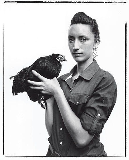 Annie Novak in black and white with a bird runs a rooftop garden in Manhattan in Greenpoint