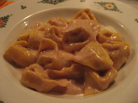 Chef Michaeil White specialties at Osteria Morini a shallow bowl of meaty tortellini covered with duck liver panna