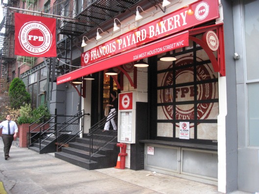 Exterior view of Francois Payard Bakery in New York with red overhang and white lettering, staircase leading into the buidling