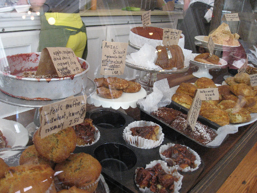 Peels New York City bakery station filled with muffins, sticky buns, cakes and other sweet treats