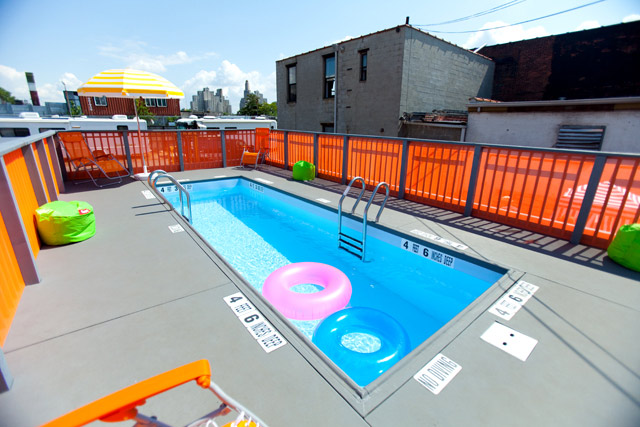 Dumpster pool in NYC surrounded by a built up deck in the streets of the city