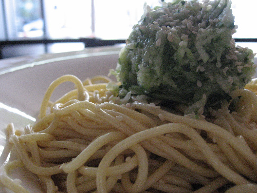 Xiao Ye dish of cold noodles with greens in a ball on top served in a white dish